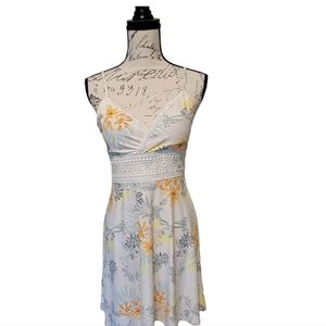 This is a Hawaiian floral 🌺 sun dress with a triangle top and lace accents.